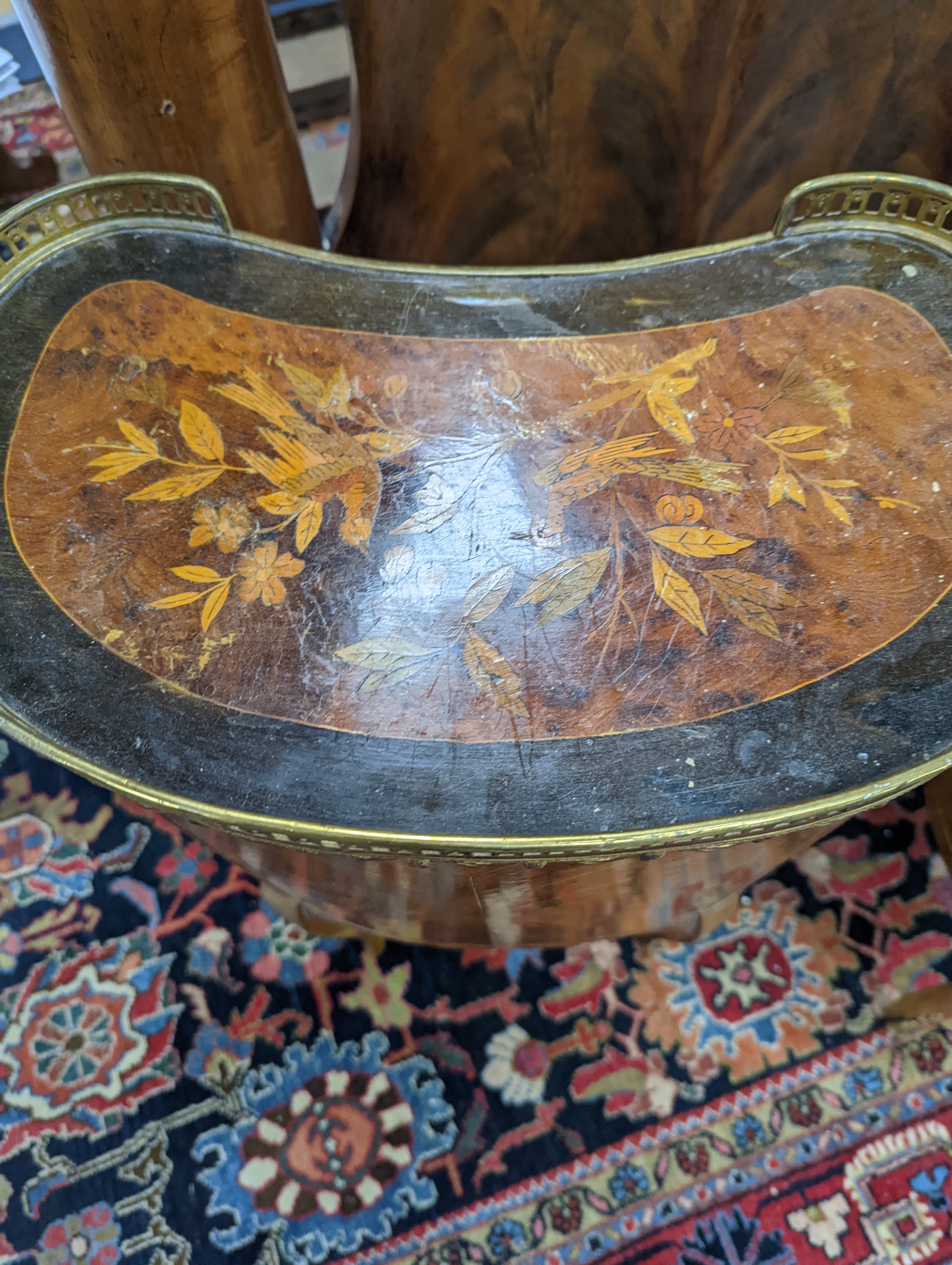 A pair of French marquetry inlaid gilt metal mounted kidney shaped two drawer bedside cabinets, width 42cm, depth 24cm, height 77cm